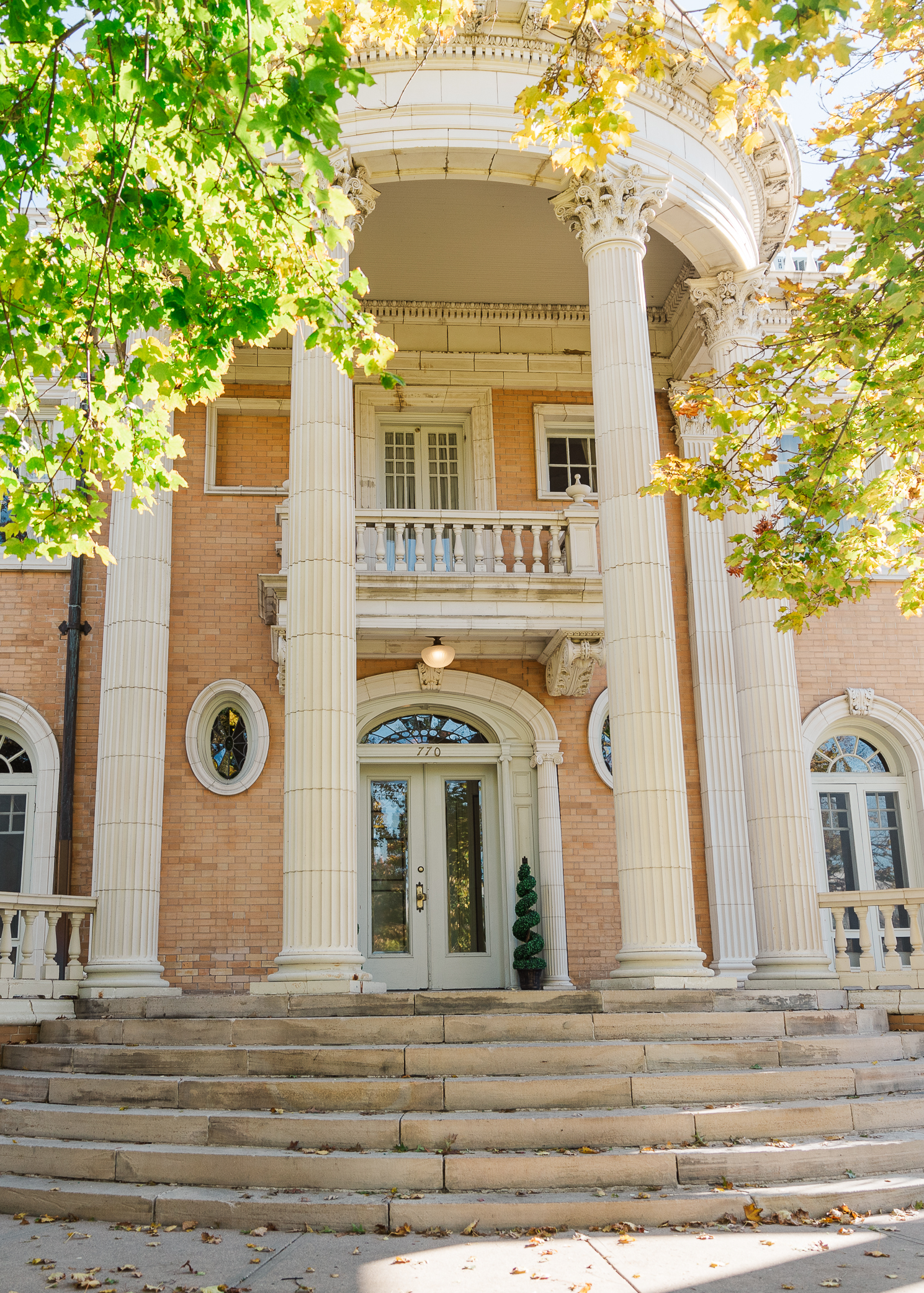 Close up shot of Grant Humphreys Mansion Wedding venue showing the pillars on the front of the building and a stairway